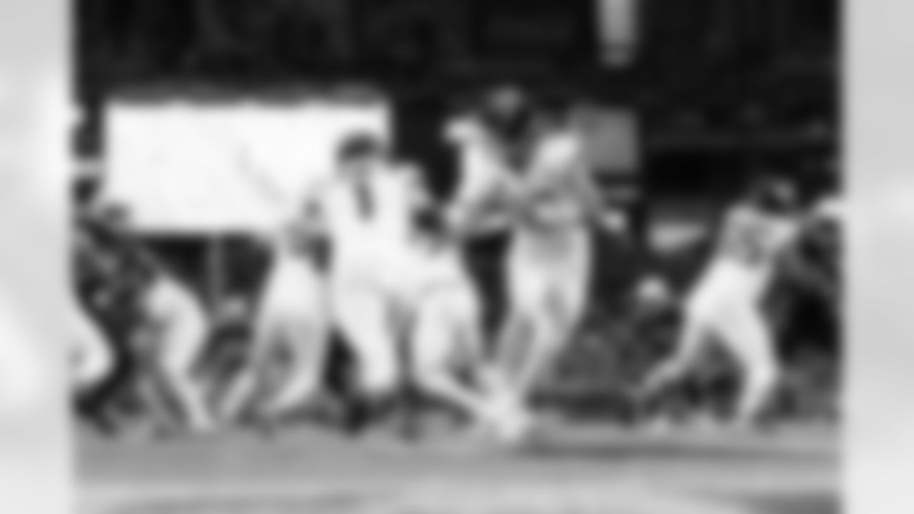 Jacksonville Jaguars vs Arizona Cardinals

RB Travis Etienne Jr. (1) and QB Trevor Lawrence (16)