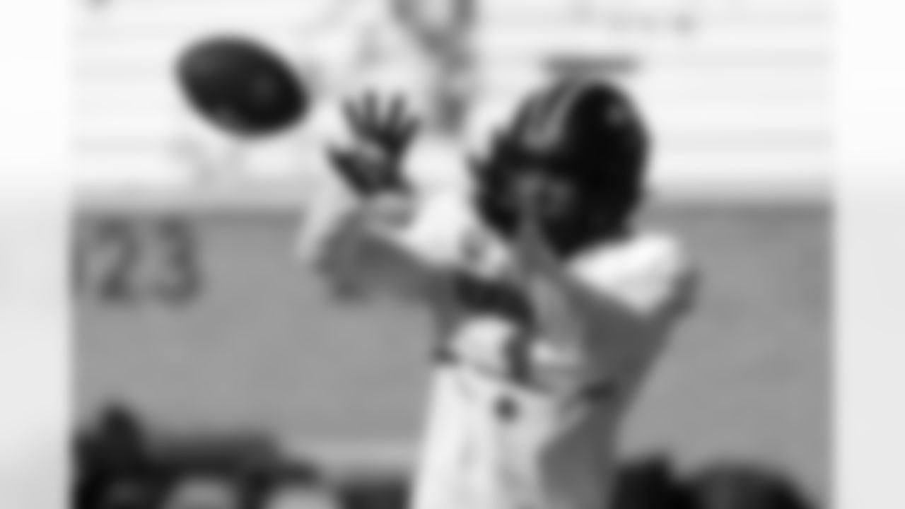 National Team wide receiver Caullin Lacy (1), of Louisville, runs through drills during practice for the Senior Bowl NCAA college football game Wednesday, Jan. 28, 2026, in Mobile, Ala. (AP Photo/Butch Dill)