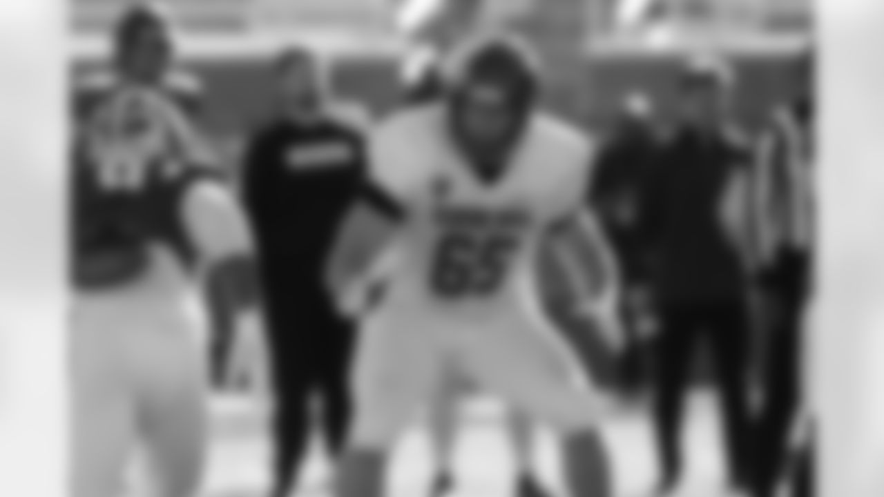 National Team offensive lineman Kage Casey (65), of Boise State, runs through drills during practice for the Senior Bowl NCAA college football game Wednesday, Jan. 28, 2026, in Mobile, Ala. (AP Photo/Butch Dill)