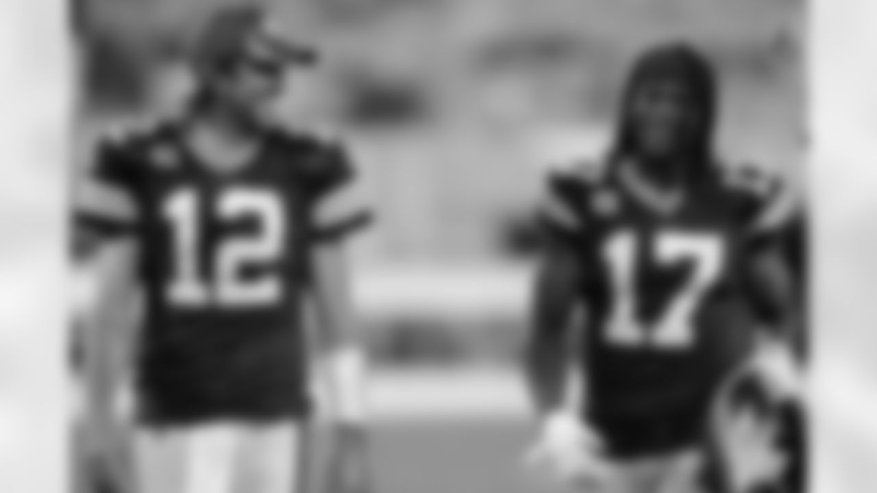 Green Bay Packers' Aaron Rodgers and Davante Adams smile as they walk off the field after an NFL football game against the Detroit Lions Monday, Sept. 20, 2021, in Green Bay, Wis. The Packers won 35-17. (AP Photo/Matt Ludtke)