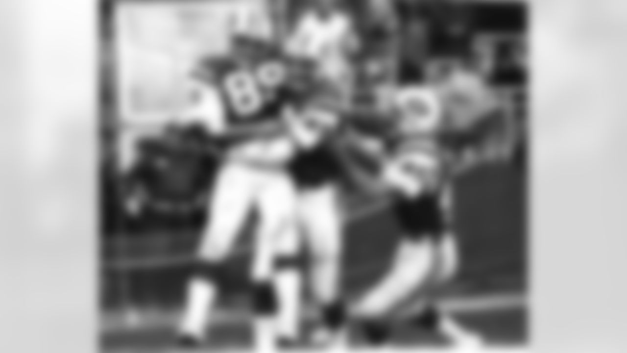 Wide receiver Lou Piccone is congratulated by Tommy Marvaso (47) and Louie Giammona (45) during the 1976 season.PicconeLactionII