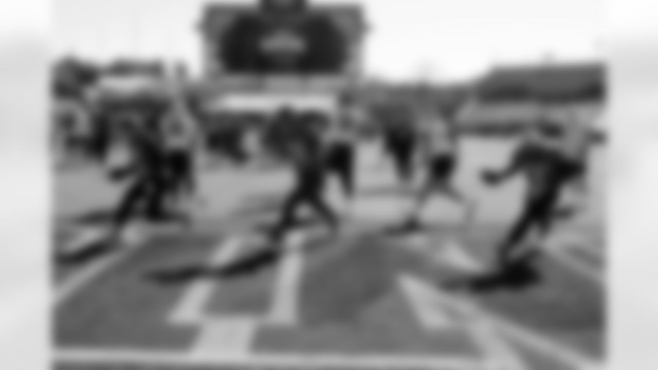 National Team quarterback's Cole Payton (9), of North Dakota State, Sawyer Robertson (12), of Baylor, and Diego Pavia (2), of Vanderbilt run through drills during practice for the Senior Bowl NCAA college football game Tuesday, Jan. 27, 2026, in Mobile, Ala. (AP Photo/Butch Dill)