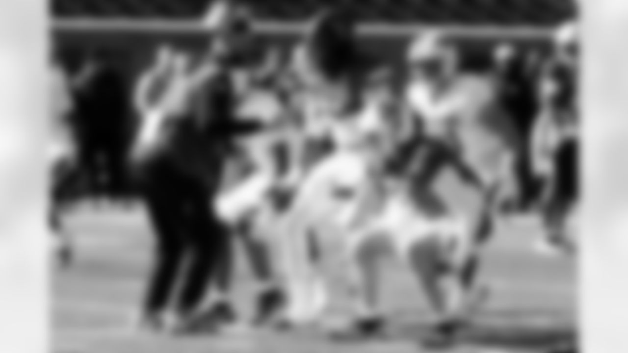 National Team coach Drew Terrell, of the Arizona Cardinals, runs through drills with players during practice for the Senior Bowl NCAA college football game Wednesday, Jan. 28, 2026, in Mobile, Ala. (AP Photo/Butch Dill)