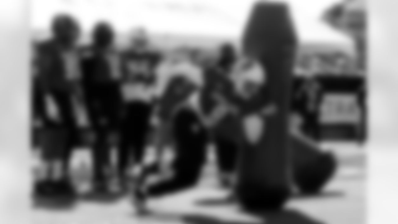 National Team defensive end Cian Slone (8), of North Carolina State, runs through drills during practice for the Senior Bowl NCAA college football game Tuesday, Jan. 27, 2026, in Mobile, Ala. (AP Photo/Butch Dill)