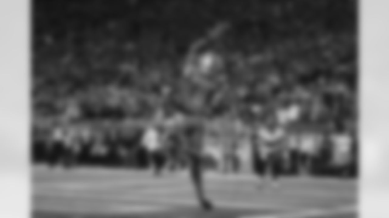 Detroit Lions wide receiver Josh Reynolds (8) catches a pass for a touchdown during an NFL divisional round playoff football game against the Tampa Bay Buccaneers, Sunday, Jan. 21, 2024 in Detroit. The Lions defeated the Buccaneers 31-23. (Margaret Bowles via AP)