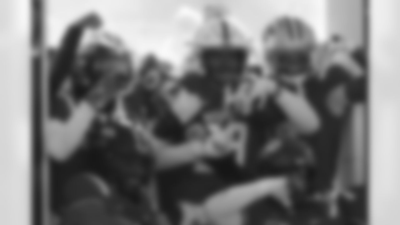 National Team safety Deshon Singleton (29), of Nebraska, celebrates with teammates after an interception during the first half of the Senior Bowl NCAA college football game Saturday, Jan. 31, 2026, in Mobile, Ala. (AP Photo/Butch Dill)