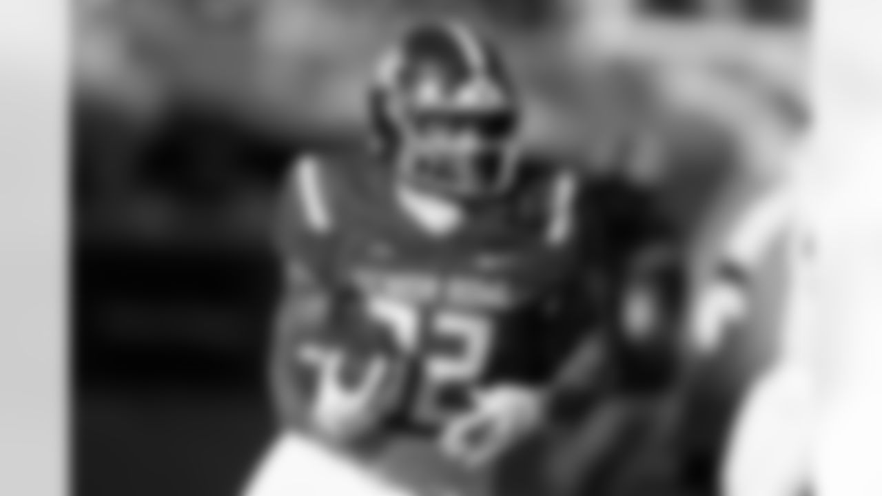 National Team running back Seth McGowan (32), of Kentucky, carries the ball during the second half of the Senior Bowl NCAA college football game Saturday, Jan. 31, 2026, in Mobile, Ala. (AP Photo/Butch Dill)