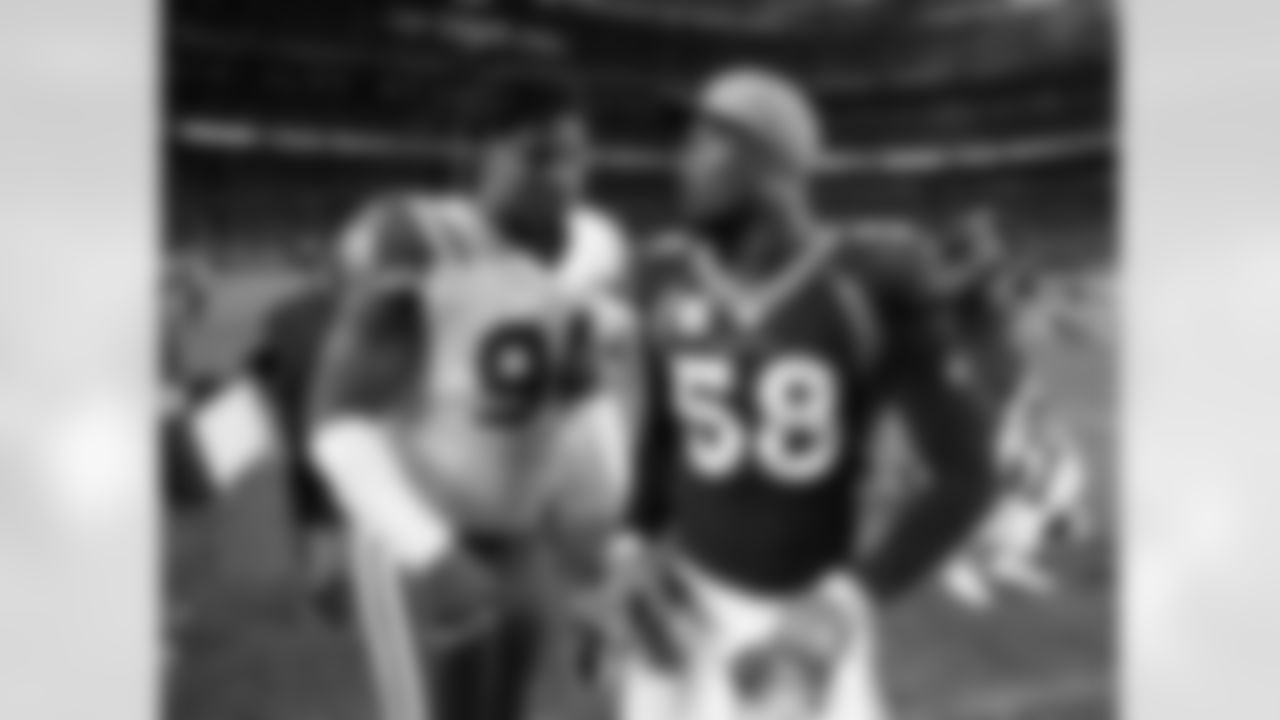 Denver Broncos outside linebacker Von Miller (58) talks with New York Jets defensive end Kony Ealy (94) after an NFL football game, Sunday, Dec. 10, 2017, in Denver. The Broncos won 23-0. (AP Photo/Joe Mahoney)