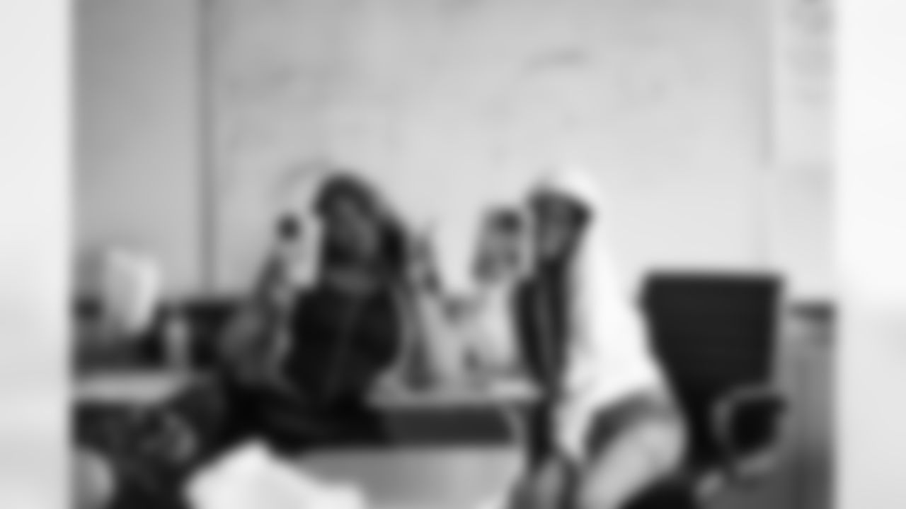 Students posing for the camera during the Presents from the Pride event at Detroit Lions Academy on Dec. 16, 2025 in Detroit. (Izzy Rincon/Detroit Lions)