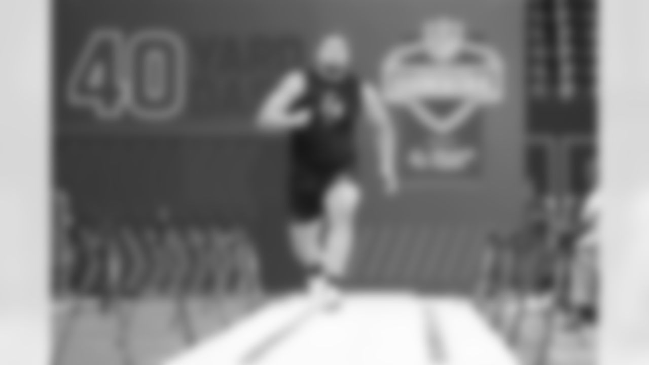 Georgia offensive lineman Monroe Freeling (24) runs a drill at the NFL football scouting combine in Indianapolis, Sunday, March 1, 2026. (AP Photo/Michael Conroy)