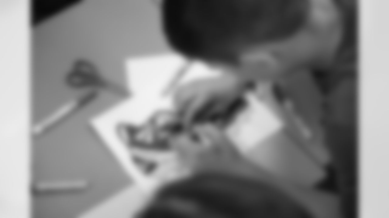 Shoe Club students work on their designs during a shoe design competition event at the Meijer Performance Center on Sept. 27, 2025 in Allen Park, Mich. (Carl Jones II/Detroit Lions via AP)