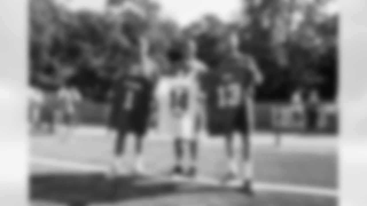 Detroit Lions wide receiver Amon-Ra St. Brown (14) with FC Köln goalkeeper Marvin Schwäbe (1) and forward Mark Uth (13) at a youth football camp on June 22, 2025 in Cologne, Germany. (Stuart Zaas/Detroit Lions)