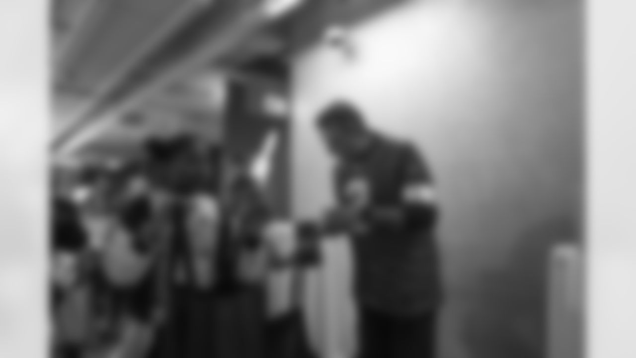 Students from Violet Elementary Trick or Treating with Lions Legend Eddie Murray (3) during the One Pride Literacy Fest at Ford Field on Oct. 28, 2025 in Detroit. (Steven Stark/Detroit Lions)