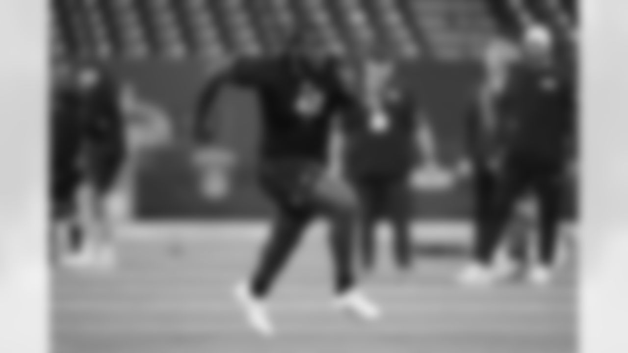 Texas A&M offensive lineman Ar'maj Reed-Adams (42) runs a drill at the NFL football scouting combine in Indianapolis, Sunday, March 1, 2026. (AP Photo/Michael Conroy)