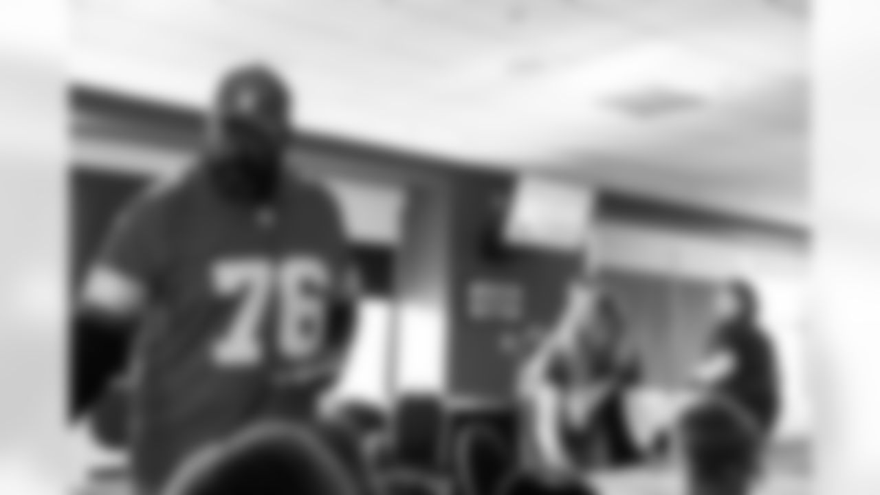 Lions Legend Scott Conover (76) handing out stickers during the One Pride Literacy Fest at Ford Field on Oct. 28, 2025 in Detroit. (Steven Stark/Detroit Lions)