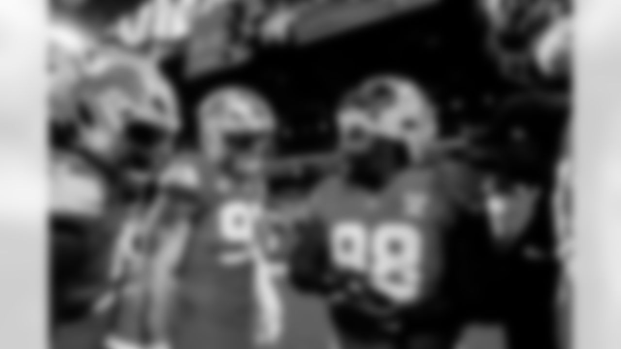 Detroit Lions edge rusher Aidan Hutchinson (97) and Detroit Lions defensive lineman DJ Reader (98) before an NFL football game against the Pittsburgh Steelers on Sunday, Dec. 21, 2025 in Detroit. (Jeff Nguyen/Detroit Lions via AP)