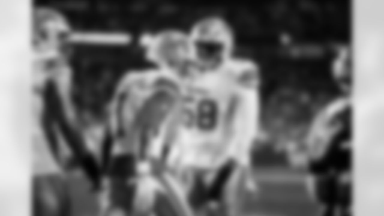 Detroit Lions wide receiver Jameson Williams (1) and Detroit Lions tackle Penei Sewell (58) celebrate after a touchdown during an NFL football game against the Washington Commanders on Sunday, Nov. 9, 2025 in Landover, Md. (Jeff Nguyen/Detroit Lions via AP)