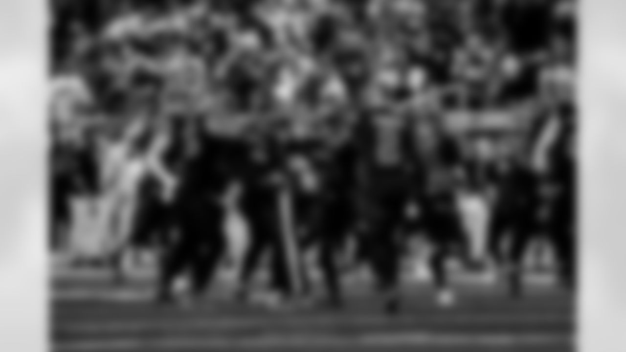 Detroit Lions linebacker Derrick Barnes (55), Detroit Lions safety Thomas Harper (12), and Detroit Lions safety Daniel Thomas (2) celebrate after an interception during an NFL football game against the New York Giants on Sunday, Nov. 23, 2025 in Detroit. (Jeff Nguyen/Detroit Lions via AP)