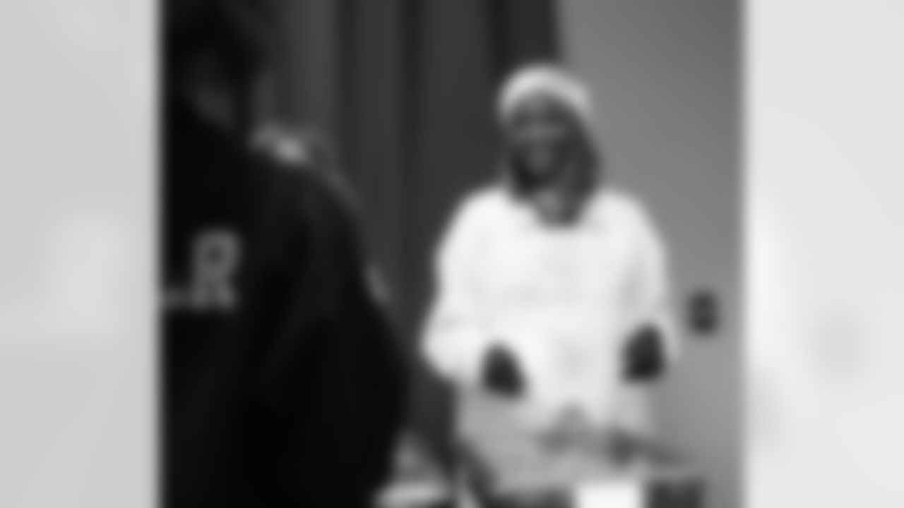 An Alternatives for Girls employee serving food during a Thanksgiving lunch event at Alternatives For Girls on Nov. 28, 2025 in Detroit. (Izzy Rincon/Detroit Lions)