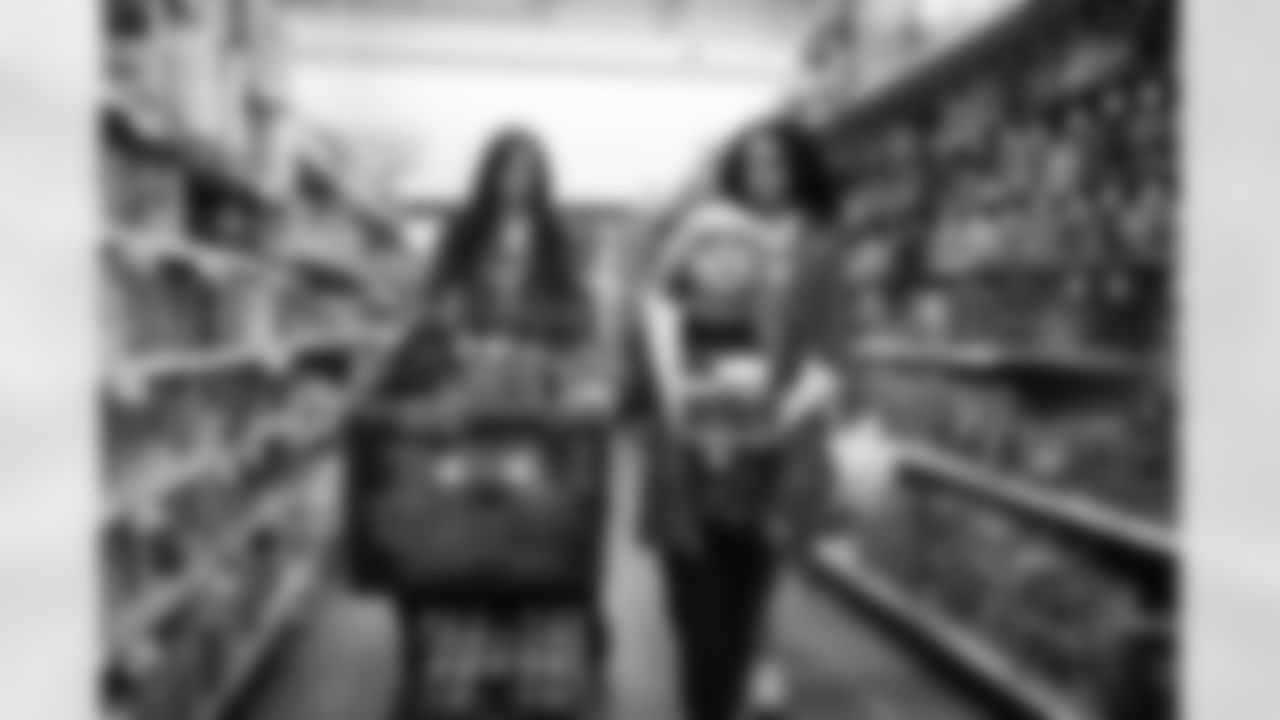 Detroit Lions Cheerleaders and a participant shopping during Shop with a Lion at Meijer on Dec. 8, 2025 in Detroit. (Izzy Rincon/Detroit Lions)