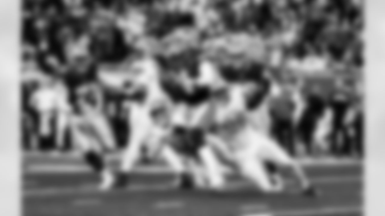 Detroit Lions edge rusher Aidan Hutchinson (97) and Detroit Lions edge rusher Al-Quadin Muhammad (96) during an NFL football game against the Dallas Cowboys on Thursday, Dec. 4, 2025 in Detroit. (Jeff Nguyen/Detroit Lions via AP)