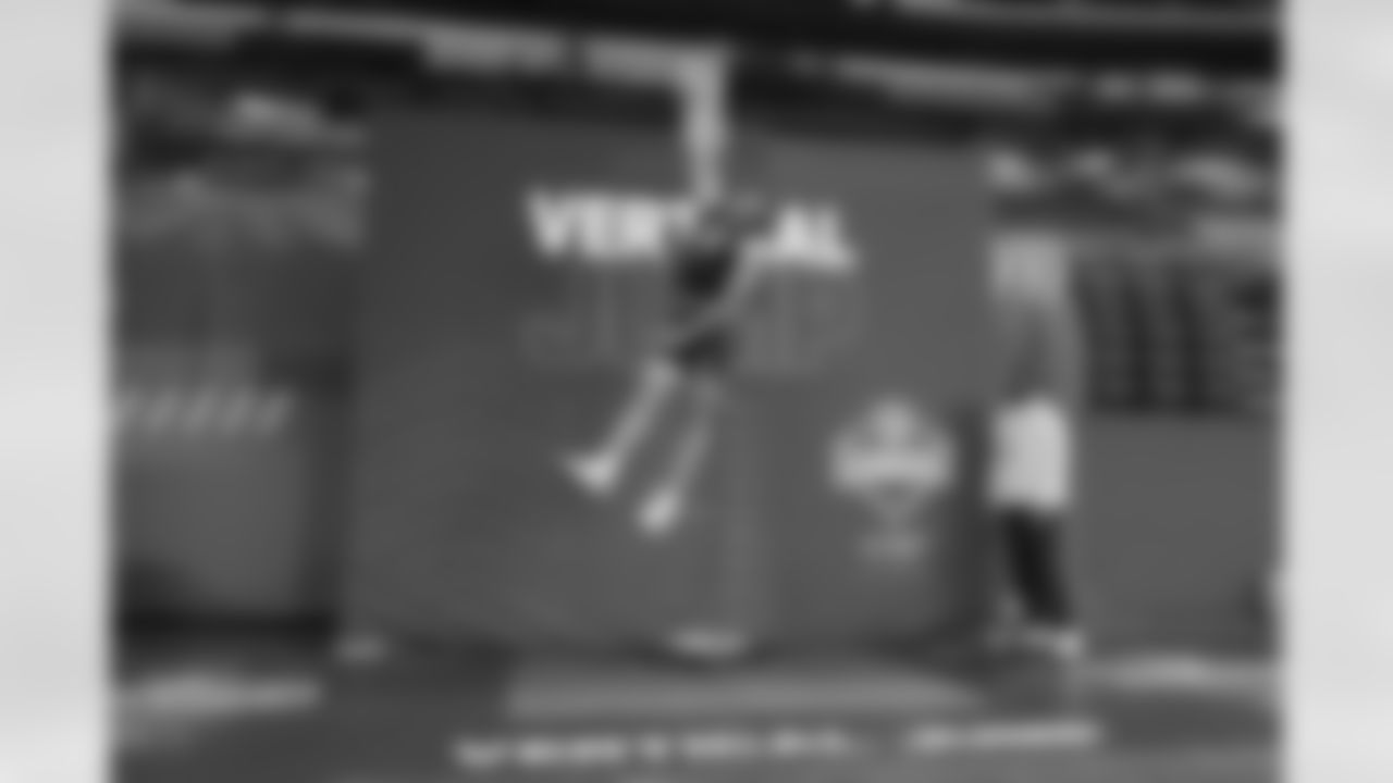 Arkansas quarterback Taylen Green (08) runs a drill at the NFL football scouting combine in Indianapolis, Saturday, Feb. 28, 2026. (AP Photo/Julio Cortez)