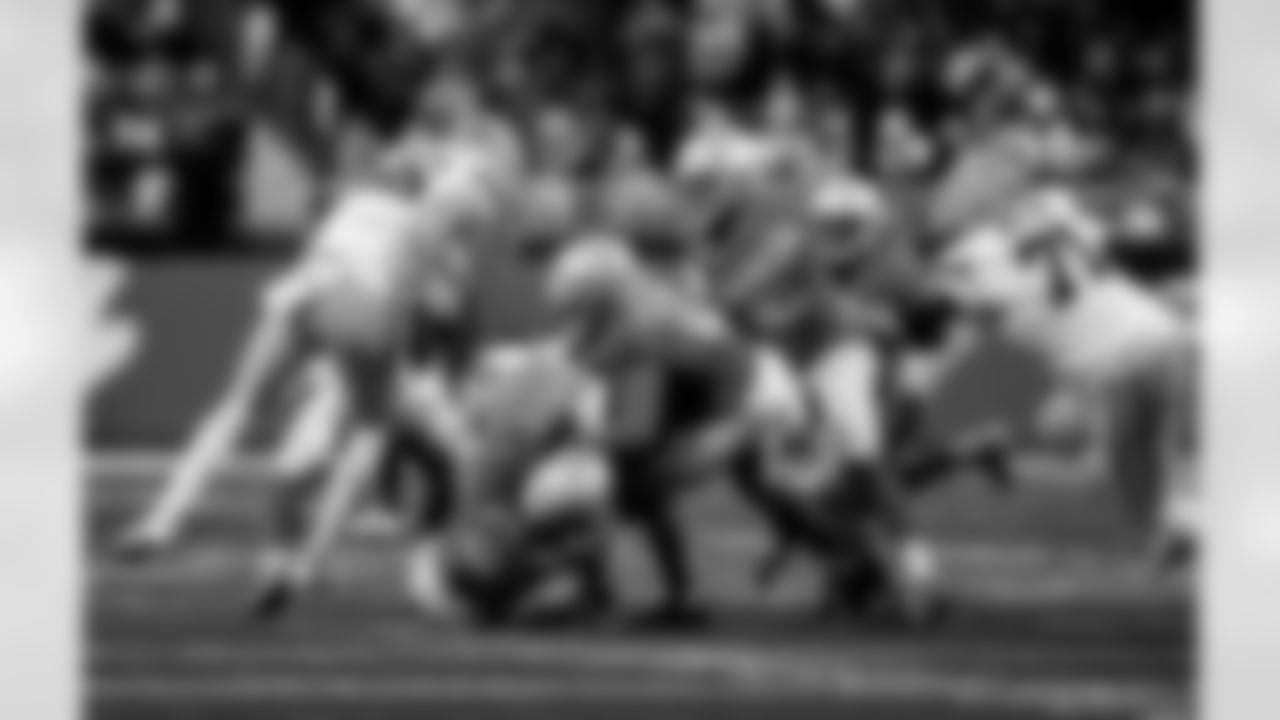 Detroit Lions linebacker Alex Anzalone (34), Detroit Lions cornerback Amik Robertson (21), and Detroit Lions defensive back Brian Branch (32) during an NFL football game against the Green Bay Packers on Thursday, Nov. 27, 2025 in Detroit. (Jeff Nguyen/Detroit Lions via AP)