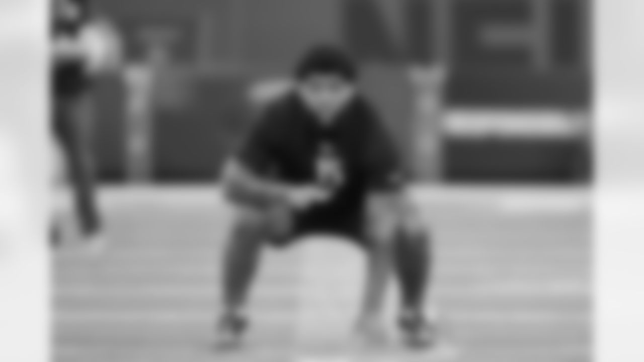 Miami offensive lineman Anez Cooper (15) runs a drill at the NFL football scouting combine in Indianapolis, Sunday, March 1, 2026. (AP Photo/Michael Conroy)