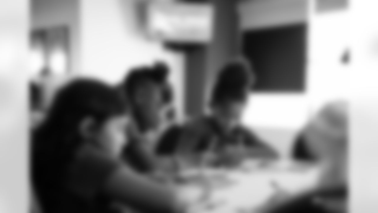 Students writing in their journals during the One Pride Literacy Fest at Ford Field on Oct. 28, 2025 in Detroit. (Steven Stark/Detroit Lions)