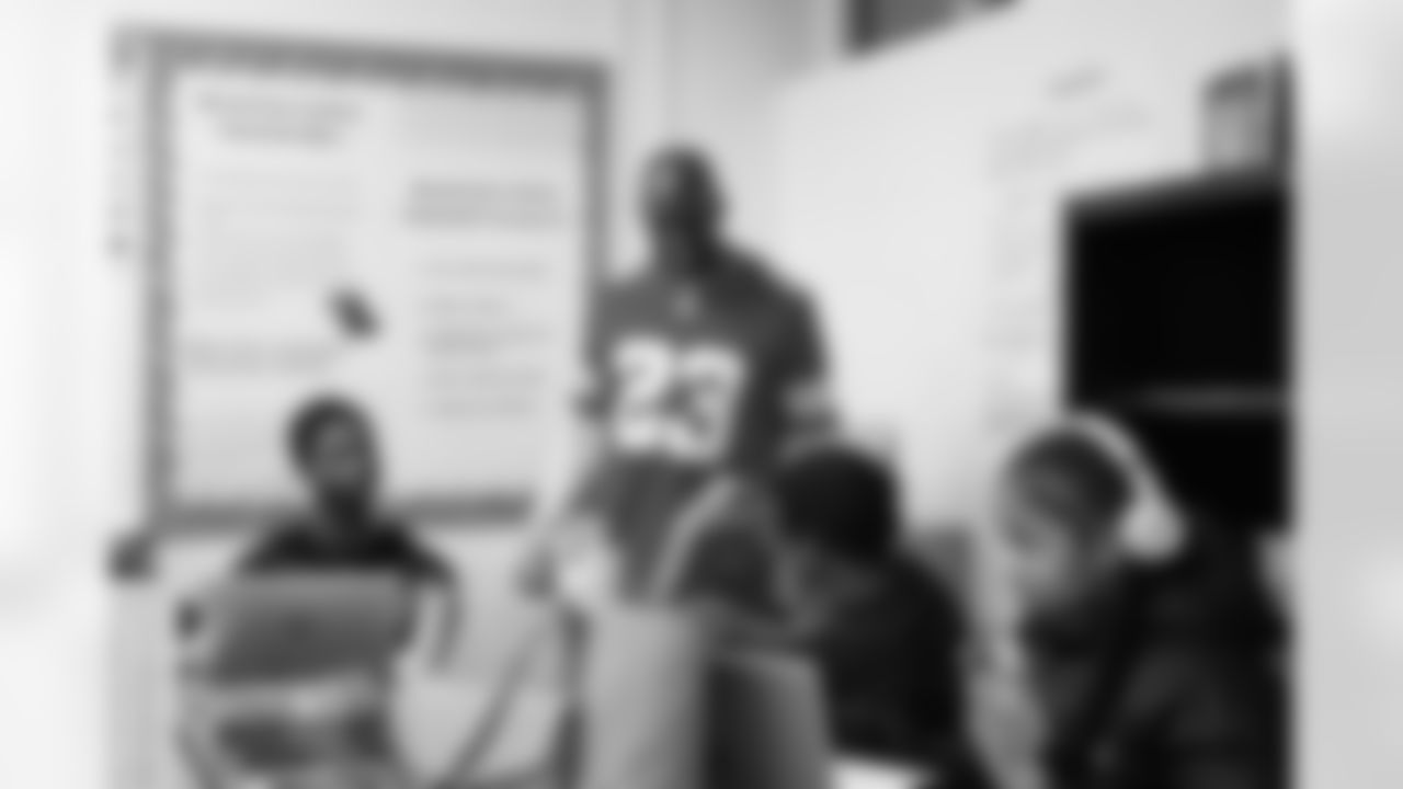 Lions Legend Maurice Harvey (23) smiling while speaking to students during the Presents from the Pride event at Detroit Lions Academy on Dec. 16, 2025 in Detroit. (Izzy Rincon/Detroit Lions)