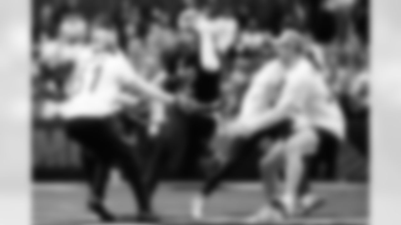 AFC wide receiver Nico Collins, of the Houston Texans, middle, runs against NFC free safety Antoine Winfield Jr. (31), of the Tampa Bay Buccaneers, and linebacker Jack Campbell, of the Detroit Lions, during the first half of NFL Pro Bowl football game in San Francisco, Tuesday, Feb. 3, 2026. (AP Photo/Jeff Chiu)