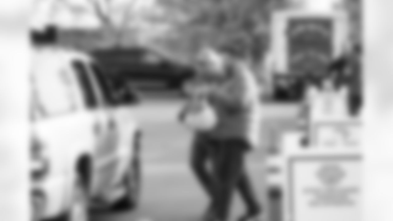 Lions staff and volunteers distribute meals during a Thanksgiving meal distribution event at the Detroit Lions Academy on Nov. 19, 2025 in Detroit. (Carl Jones II/Detroit Lions)