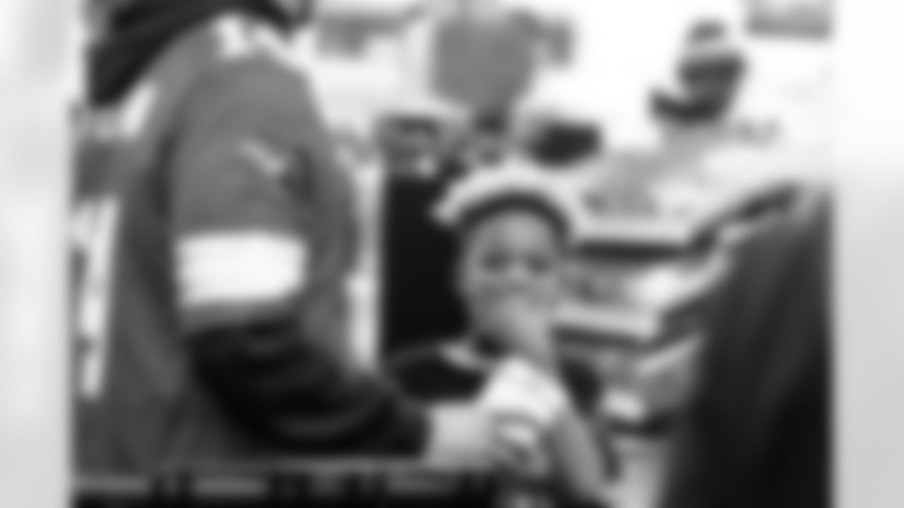 Participant poses for a photo during Shop with a Lion at Meijer on Dec. 8, 2025 in Detroit. (Stephanie VanWagoner/Detroit Lions)