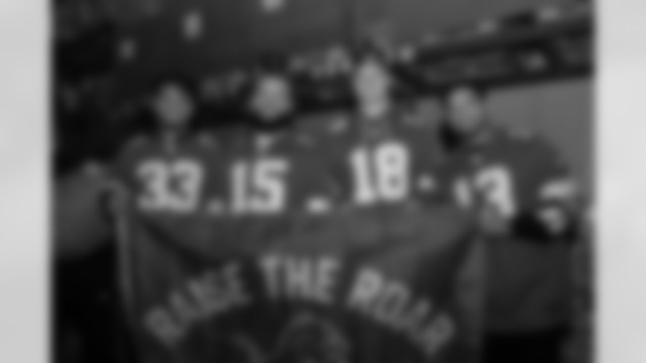 Detroit Lions running back Sione Vaki (33), Detroit Lions linebacker Grant Stuard (15), Detroit Lions wide receiver Isaac TeSlaa (18), and Detroit Lions running back Craig Reynolds (13) pose for a photo during a Thanksgiving meal packing event at Gleaners Community Food Bank on Nov. 11, 2025 in Taylor, Mich. (Izzy Rincon/Detroit Lions)