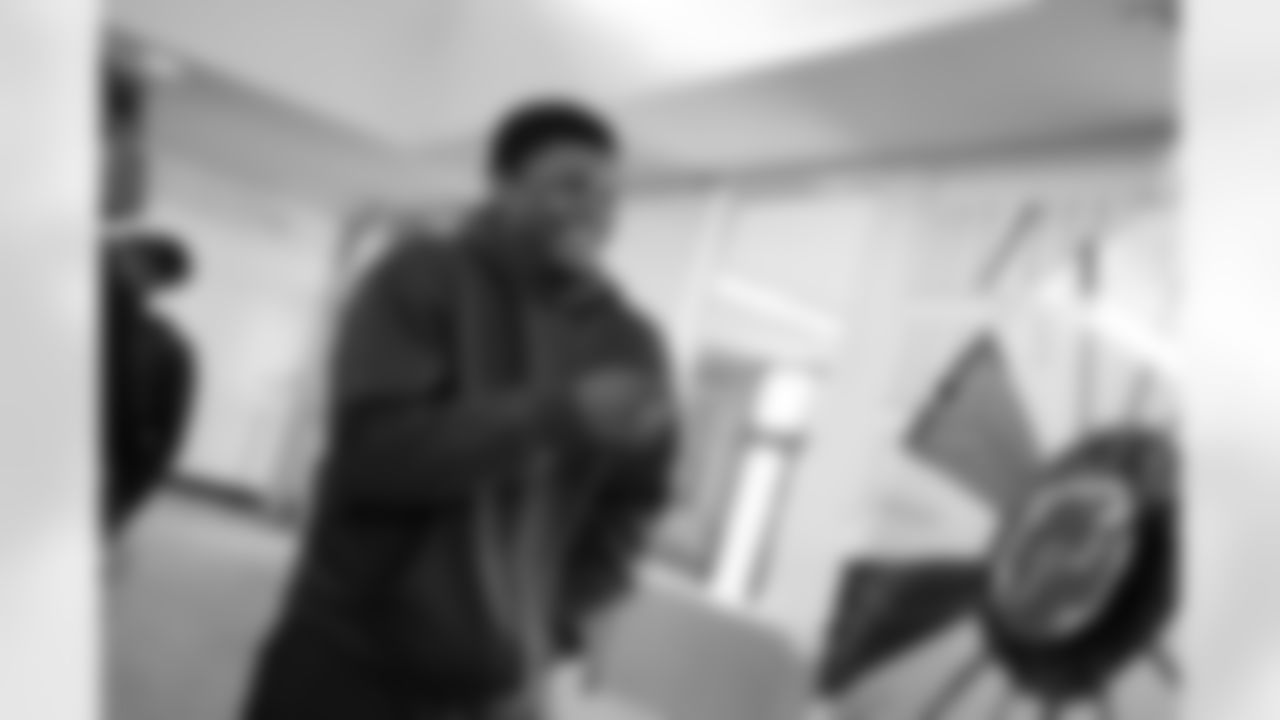 A student spinning the wheel for a prize during the Presents from the Pride event at Detroit Lions Academy on Dec. 16, 2025 in Detroit. (Izzy Rincon/Detroit Lions)