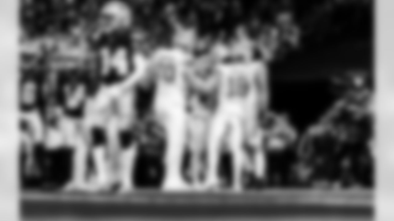 Detroit Lions tackle Dan Skipper (70), Detroit Lions running back Jahmyr Gibbs (0), and Detroit Lions wide receiver Isaac TeSlaa (18) celebrate after a touchdown during an NFL football game against the Dallas Cowboys on Thursday, Dec. 4, 2025 in Detroit. (Jeff Nguyen/Detroit Lions via AP)