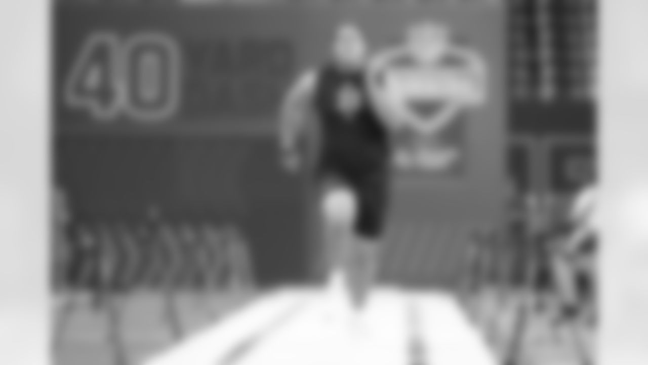 Utah offensive lineman Caleb Lomu (33) runs a drill at the NFL football scouting combine in Indianapolis, Sunday, March 1, 2026. (AP Photo/Michael Conroy)