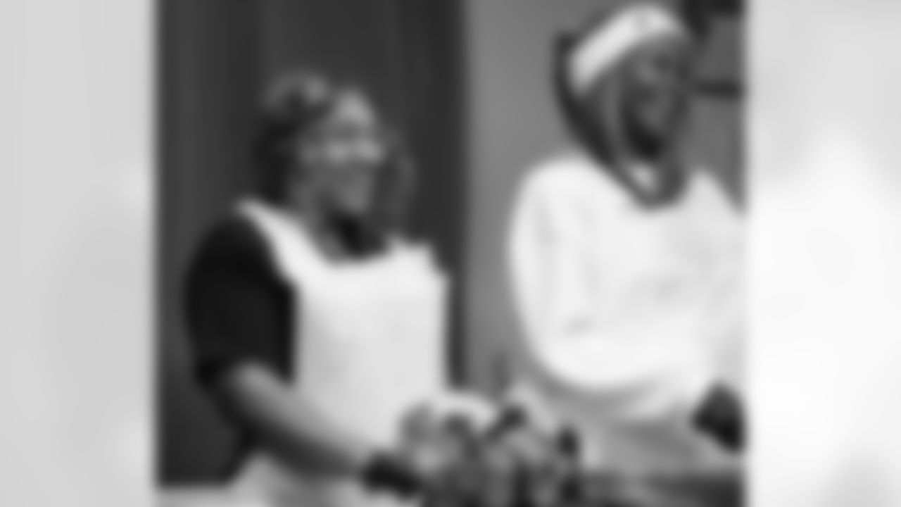 Alternatives for Girls employees serving food during a Thanksgiving lunch event at Alternatives For Girls on Nov. 28, 2025 in Detroit. (Izzy Rincon/Detroit Lions)