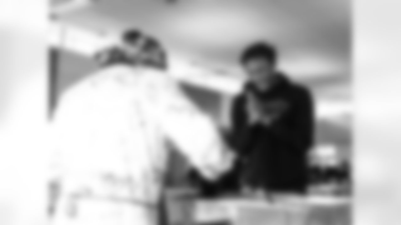 A student getting lunch during the Presents from the Pride event at Detroit Lions Academy on Dec. 16, 2025 in Detroit. (Izzy Rincon/Detroit Lions)