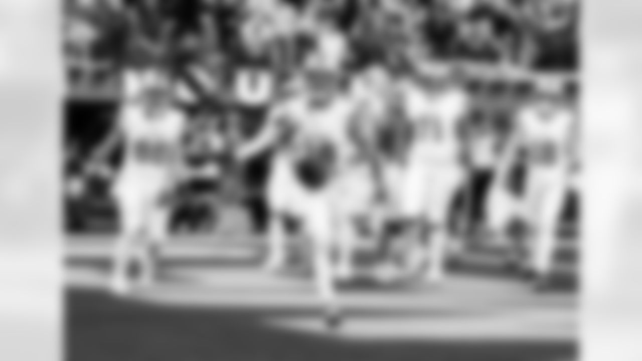 Detroit Lions wide receiver Amon-Ra St. Brown (14) scores a touchdown during an NFL football game against the Los Angeles Rams on Sunday, Dec. 14, 2025 in Inglewood, Calif. (Jeff Nguyen/Detroit Lions via AP)