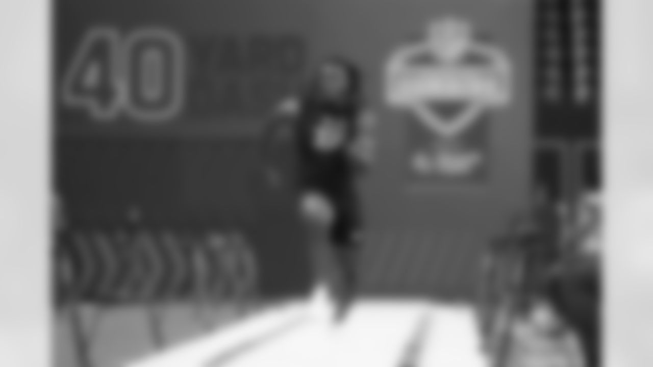 Michigan defensive lineman Jaishawn Barham (33) runs the 40-yard dash at the NFL football scouting combine in Indianapolis, Thursday, Feb. 26, 2026. (AP Photo/Julio Cortez)