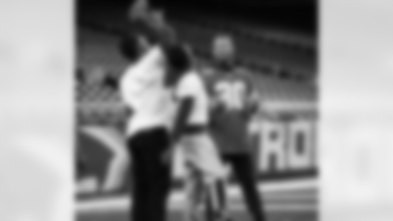 Detroit Lions cornerback Khalil Dorsey (30) interacting with participants during the Inspire Change Football Clinic at Ford Field on Dec. 9, 2025 in Detroit. (Izzy Rincon/Detroit Lions)