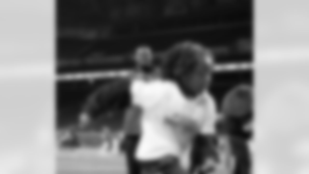 Lions Legend Martell Webb throwing a football during the Inspire Change Football Clinic at Ford Field on Dec. 9, 2025 in Detroit. (Izzy Rincon/Detroit Lions)