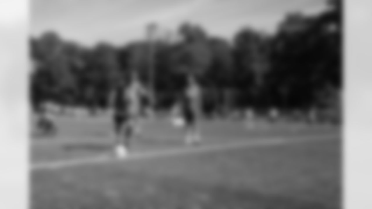 Detroit Lions wide receiver Amon-Ra St. Brown (14) kicks a soccer ball at a Detroit Lions youth football camp on June 22, 2025 in Cologne, Germany. (Stuart Zaas/Detroit Lions)