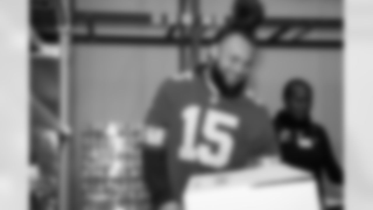 Detroit Lions linebacker Grant Stuard (15) smiling during a Thanksgiving meal packing event at Gleaners Community Food Bank on Nov. 11, 2025 in Taylor, Mich. (Izzy Rincon/Detroit Lions)