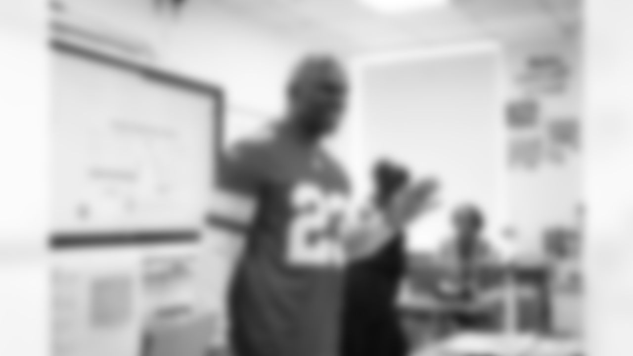 Lions Legend Maurice Harvey (23) smiling while speaking to students during the Presents from the Pride event at Detroit Lions Academy on Dec. 16, 2025 in Detroit. (Izzy Rincon/Detroit Lions)