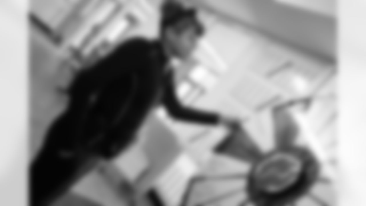 A student spinning the wheel for a prize during the Presents from the Pride event at Detroit Lions Academy on Dec. 16, 2025 in Detroit. (Izzy Rincon/Detroit Lions)