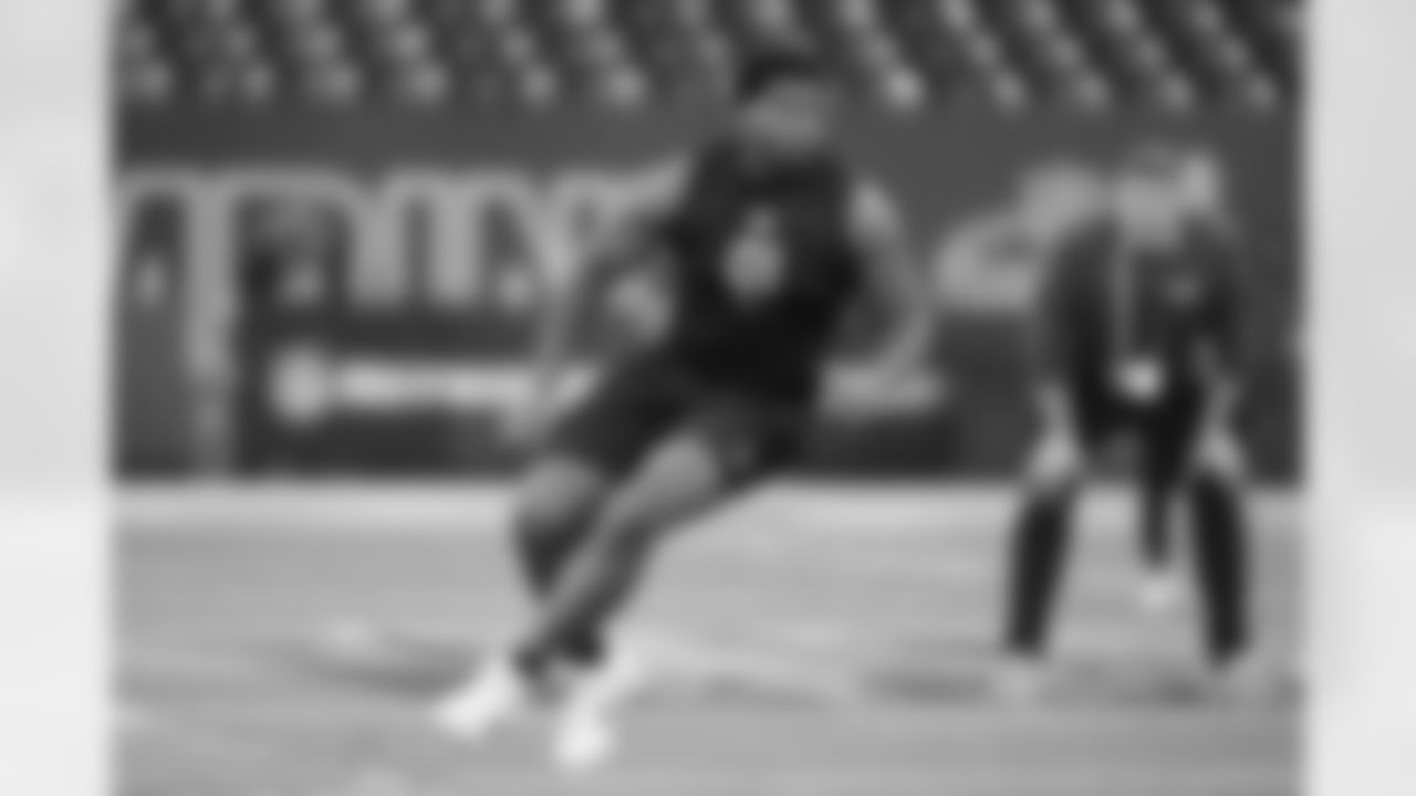 Memphis offensive lineman Chris Adams (01) runs a drill at the NFL football scouting combine in Indianapolis, Sunday, March 1, 2026. (AP Photo/Michael Conroy)