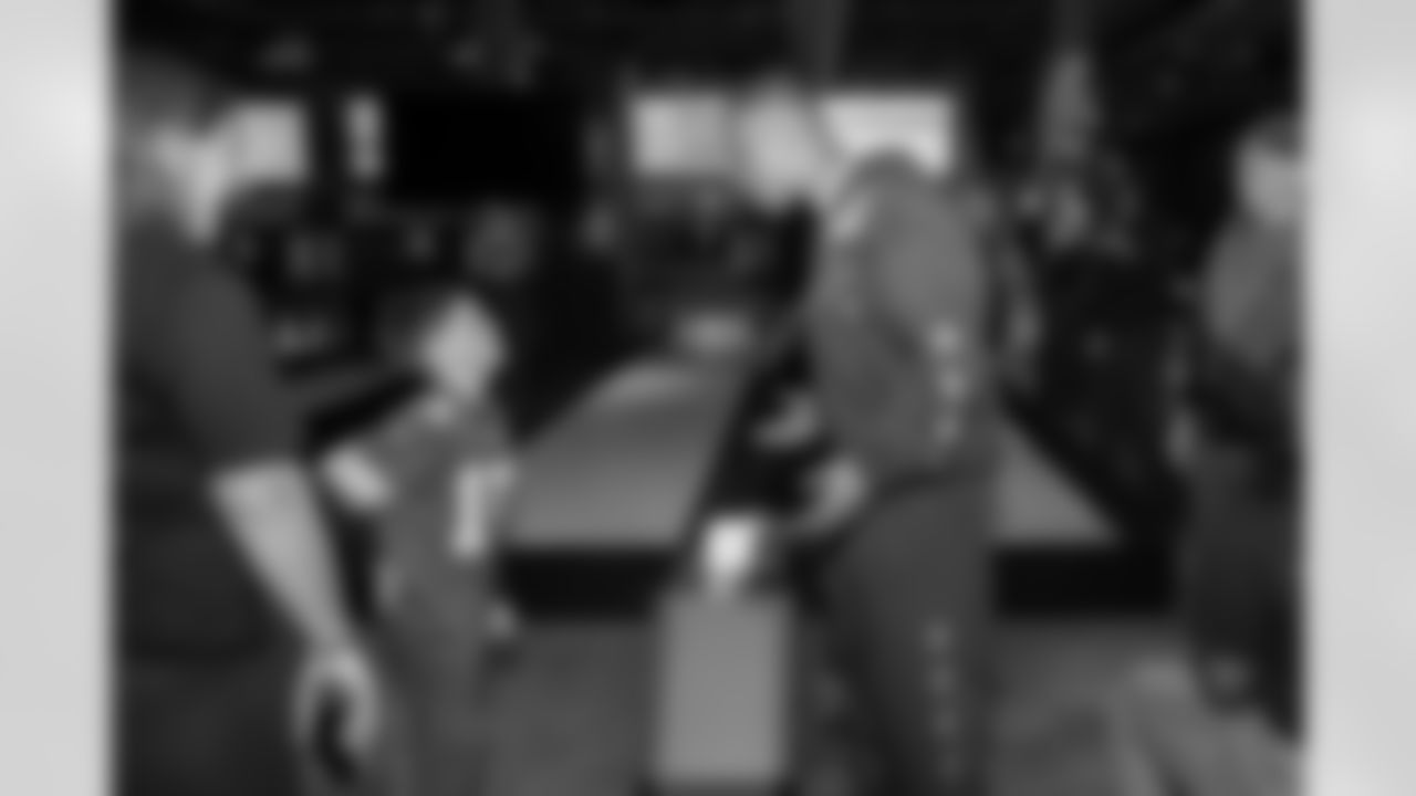 Detroit Lions wide receiver Amon-Ra St. Brown (14) greets guests during a Strike for Literacy event at Five Iron Golf on Nov. 3, 2025 in Detroit.(Carl Jones II/Detroit Lions)