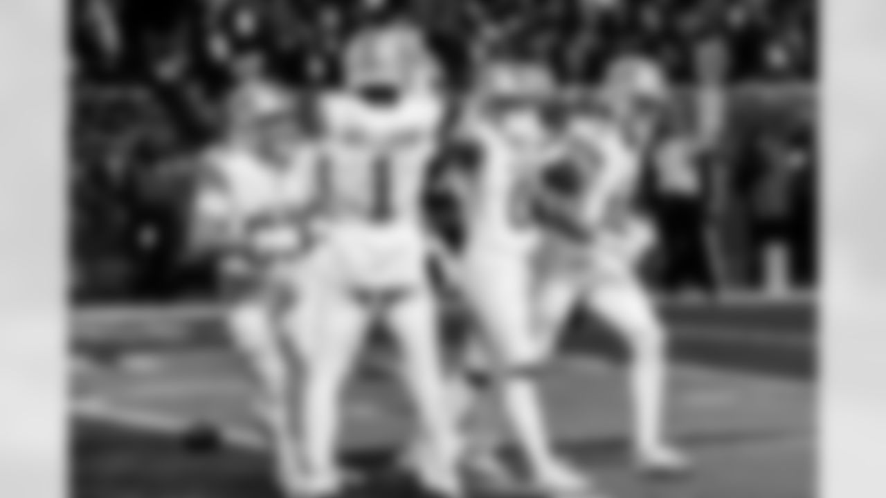 Detroit Lions wide receiver Tom Kennedy (85), Detroit Lions wide receiver Jameson Williams (1), Detroit Lions running back Jahmyr Gibbs (0), and Detroit Lions wide receiver Isaac TeSlaa (18) celebrate after a touchdown during an NFL football game against the Chicago Bears on Sunday, Jan. 4, 2026 in Chicago. (Jeff Nguyen/Detroit Lions via AP)